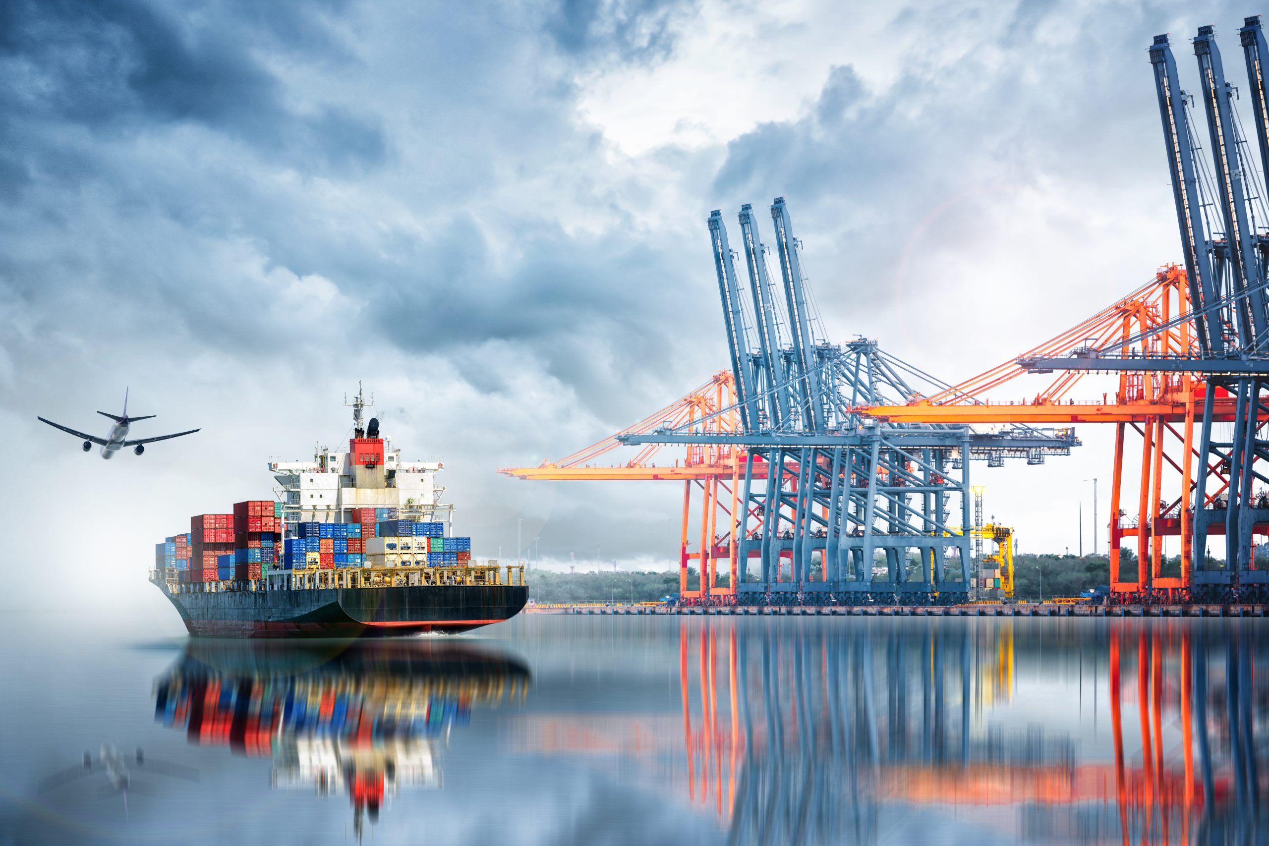Container,Cargo,Ship,And,Cargo,Plane,With,Working,Crane,Bridge